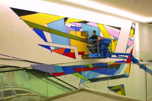 city-center_piero-manrique-working-on-city-center-mural-with-airbrush